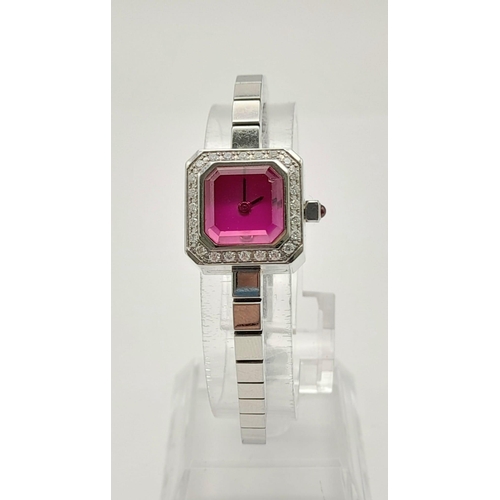 304 - A LADIES CORUM DIAMOND WATCH WITH PINK FACE AND CROWN.