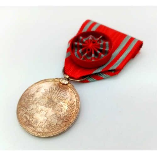 818 - Japanese WW2 Red Cross Order Medal with Rosette, comes in Original Presentation Box.