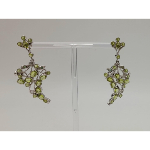 860 - A Pair of Peridot Silver Earrings -925 Sterling silver. Peridot- 20Ct. 15.70g total weight.