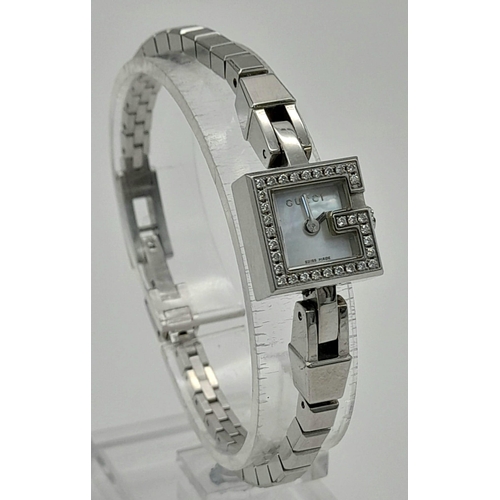 875 - A LADIES DIAMOND GUCCI LADIES WRIST WATCH WIRH SQUARE FACE IN STAINLESS STEEL. GOOD CONDITION  F.W.O... 