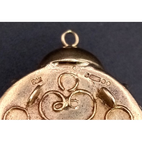 938 - A 9K GOLD CLOCK PENDANT OR CHARM DECORATED WITH GEMSTONES .  12gms