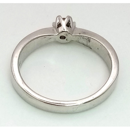 945 - A 9K White Gold Diamond Solitaire Ring. 0.10ct. Size N. 3.8g total weight.