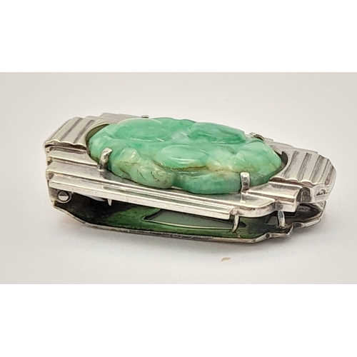 979 - An Antique Art Deco Hand-Carved Oval Jade Clip-On Piece set in 9K White Gold. 7.5g total weight. 3cm... 