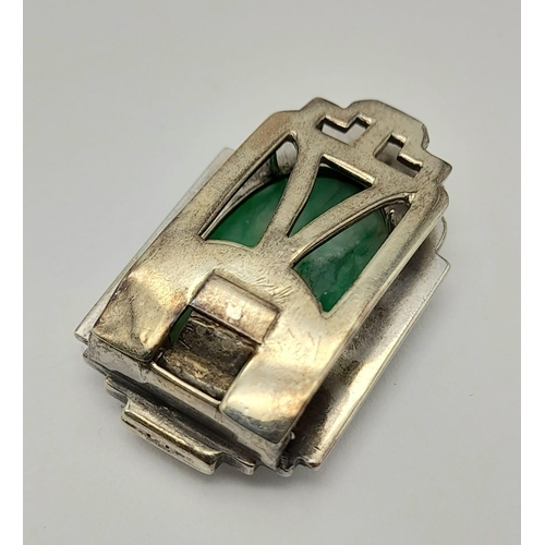 979 - An Antique Art Deco Hand-Carved Oval Jade Clip-On Piece set in 9K White Gold. 7.5g total weight. 3cm... 