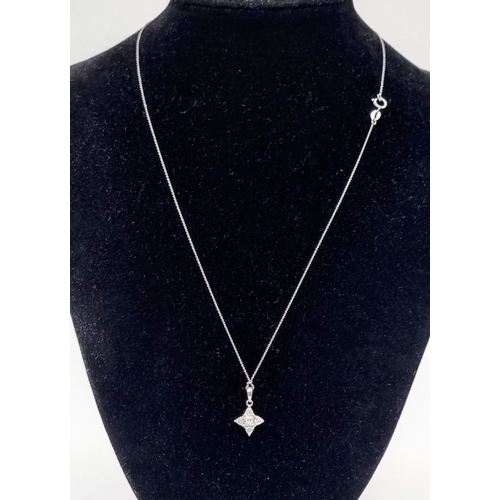 952 - An 18K White Gold and Diamond Star Pendant on an 18k White Gold Necklace. 18mm and 42cm. 1.9g total ... 