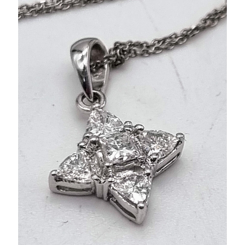 952 - An 18K White Gold and Diamond Star Pendant on an 18k White Gold Necklace. 18mm and 42cm. 1.9g total ... 