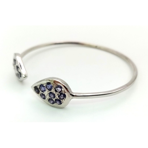 972 - An Open-Ended Silver Kyanite Bangle. 925 Sterling silver. 1.01Ct, 9.60g. 5.5cm inner diameter.