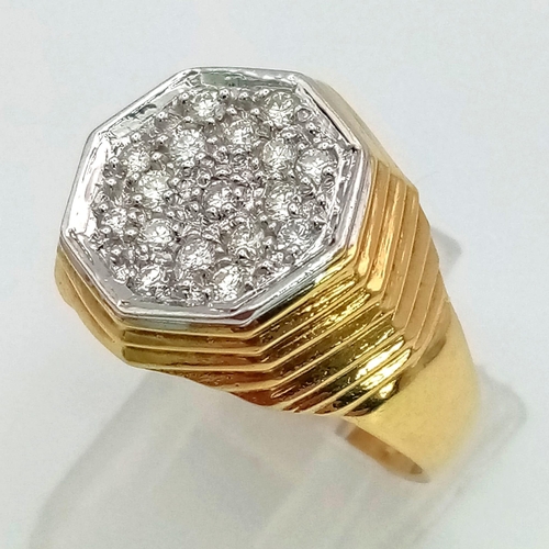 973 - AN 18K GOLD AND DIAMOND GENTS PINKY RING WITH OCTAGONAL CENTRE CONTAING INSET DIAMONDS.  7gms   size... 