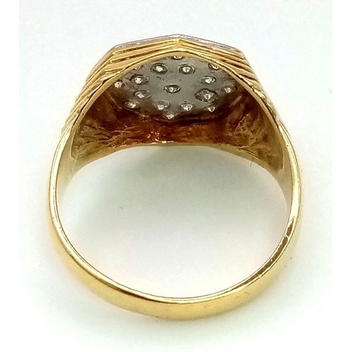 973 - AN 18K GOLD AND DIAMOND GENTS PINKY RING WITH OCTAGONAL CENTRE CONTAING INSET DIAMONDS.  7gms   size... 