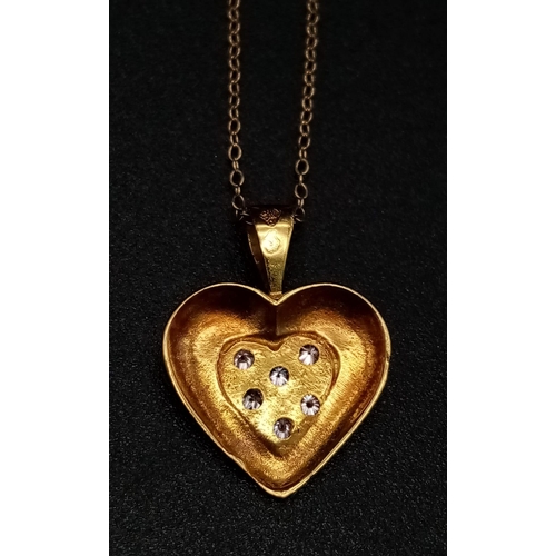 985 - An 18K Yellow Gold and Diamond Heart Pendant on an 18K Yellow Gold disappearing necklace. 15mm and 4... 