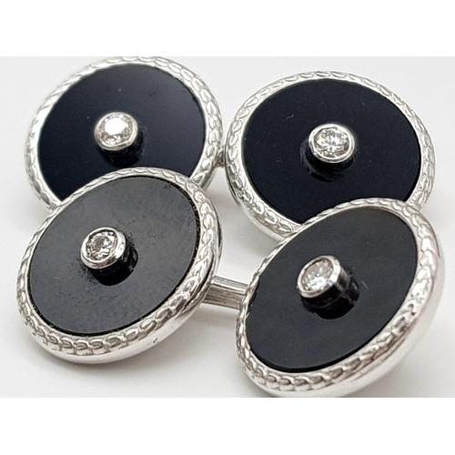 1014 - A Pair of Edwardian 18K White Gold Diamond and Onyx Cufflinks. Makers mark of Deakin and Francis. 11... 