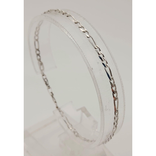 218 - An 18K White Gold Figaro Link Bracelet. 19cm. 3.64g. Ref: 5-730.