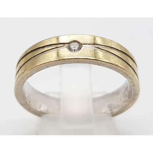 528 - An 18K White and Gold Ring with Two Small Diamonds. Size T. 8.44g total weight. Ref: 5-1071