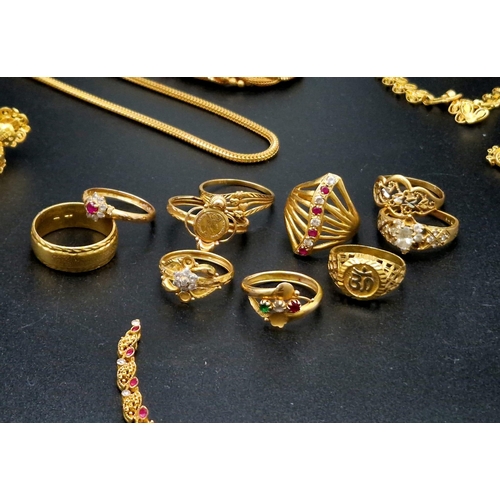 584 - A Huge Gold Lot. Consisting of: 22K - Multiple items including pendants, bracelets chains, rings and... 