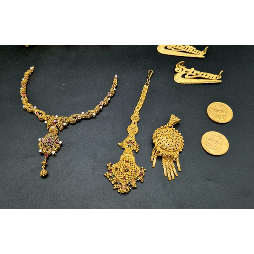 584 - A Huge Gold Lot. Consisting of: 22K - Multiple items including pendants, bracelets chains, rings and... 