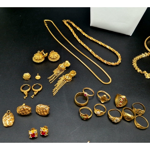 584 - A Huge Gold Lot. Consisting of: 22K - Multiple items including pendants, bracelets chains, rings and... 