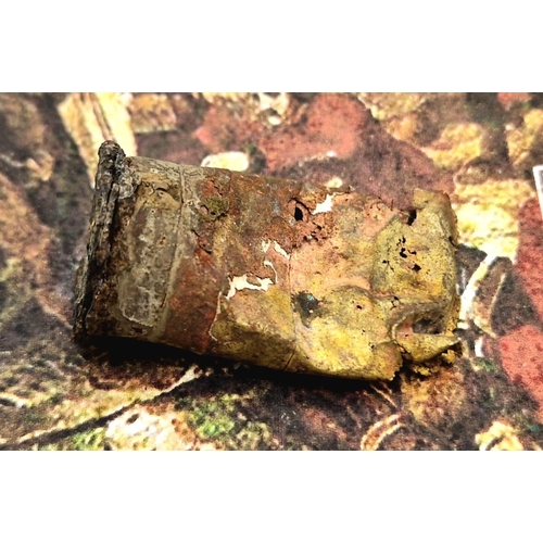 164 - A relic condition Martini-Henry cartridge case. A Piece of Cartridge Case Recovered From the Battlef... 