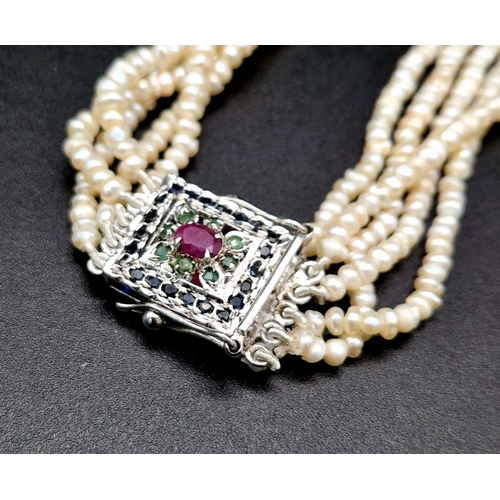 185 - A Vintage Seed Pearl Five Row Necklace with Sapphire, Ruby and emerald Clasp. 44cm