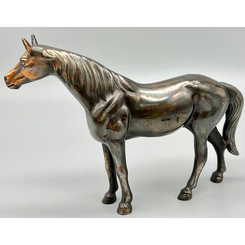 1194 - A Bronzed Sculpture of a Horse. 18cm x 13cm.