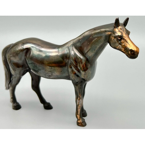 1194 - A Bronzed Sculpture of a Horse. 18cm x 13cm.