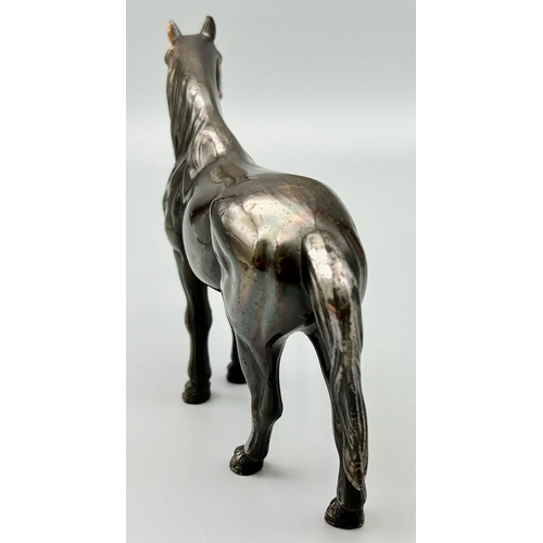 1194 - A Bronzed Sculpture of a Horse. 18cm x 13cm.