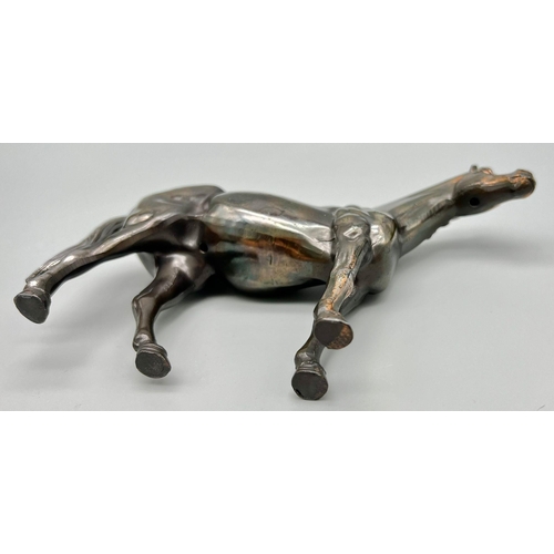 1194 - A Bronzed Sculpture of a Horse. 18cm x 13cm.