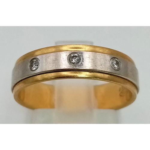 20 - An 18K Yellow and White Gold Diamond Band Trilogy Ring. 
Size M. 4.78g total weight.