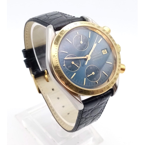 307 - AN OMEGA SPEEDMASTER AUTOMATIC CHRONOGRAPH WITH GOLDEN BEZEL AND STUNNING BLUE DIAL, 3 SUBDIALS AND ... 