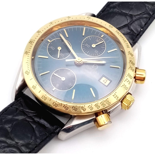 307 - AN OMEGA SPEEDMASTER AUTOMATIC CHRONOGRAPH WITH GOLDEN BEZEL AND STUNNING BLUE DIAL, 3 SUBDIALS AND ... 