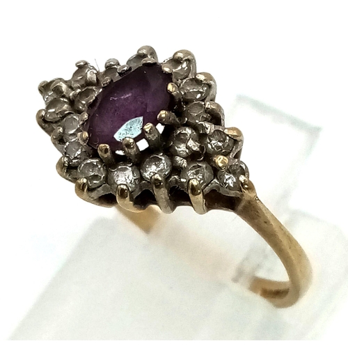 533 - A Vintage 9K Yellow Gold Amethyst and Diamond Ring. Central amethyst surrounded by a halo of diamond... 