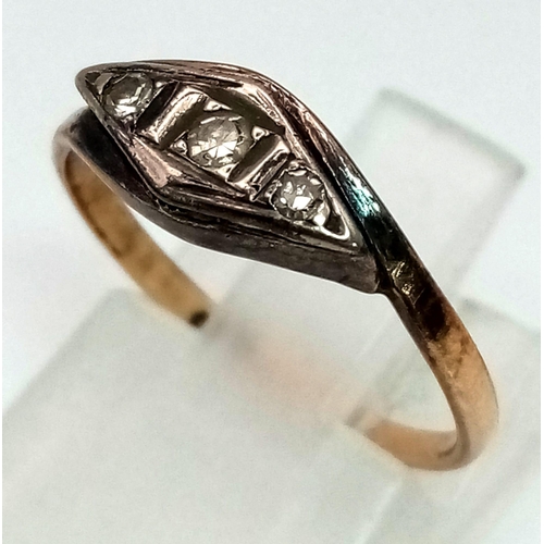 617 - An Antique 18K Gold Diamond Trilogy Ring. Size K. 1.2g total weight.