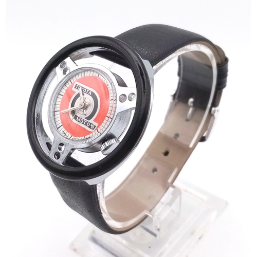 686 - A RARE COLLECTERS WATCH THE TOYOTA MOTOR WRIST WATCH IN THE SHAPE OF A STEERING WHEEL..