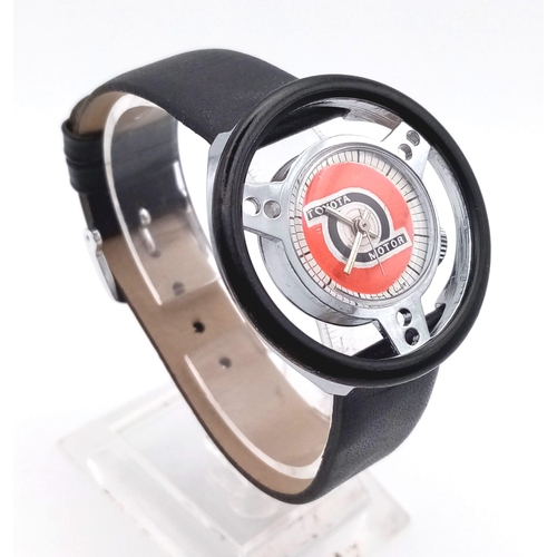 686 - A RARE COLLECTERS WATCH THE TOYOTA MOTOR WRIST WATCH IN THE SHAPE OF A STEERING WHEEL..