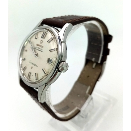 644 - AN OMEGA CONSTELLATION AUTOMATIC WATCH WITH SECOND HAND AND DATE BOX ON A BROWN LEATHER STRAP.