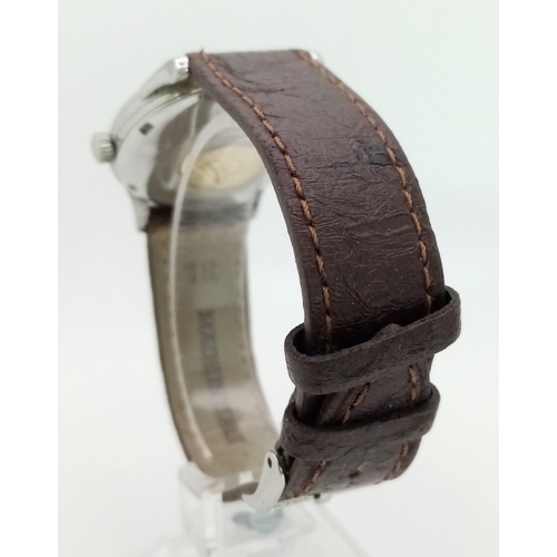 644 - AN OMEGA CONSTELLATION AUTOMATIC WATCH WITH SECOND HAND AND DATE BOX ON A BROWN LEATHER STRAP.