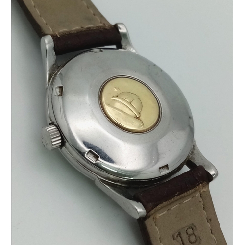 644 - AN OMEGA CONSTELLATION AUTOMATIC WATCH WITH SECOND HAND AND DATE BOX ON A BROWN LEATHER STRAP.