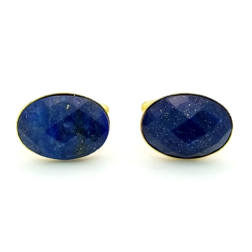 754 - A pair of Faceted, Lapis Lazuli Cufflinks, on yellow metal.