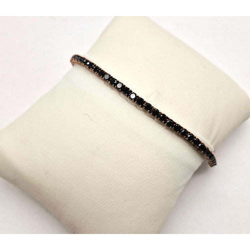 1021 - A 9K ROSE GOLD TENNIS BRACELET WITH 67 BLACK DIAMONDS TOTALLING 4ct  8.8gms  19cms .