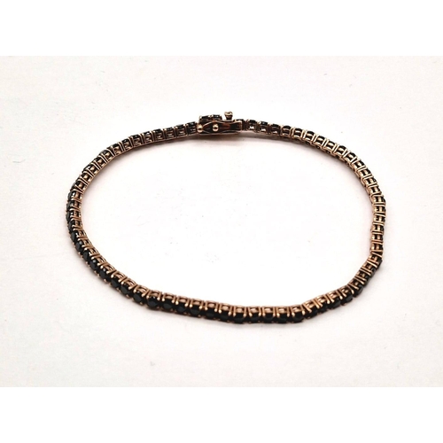 1021 - A 9K ROSE GOLD TENNIS BRACELET WITH 67 BLACK DIAMONDS TOTALLING 4ct  8.8gms  19cms .