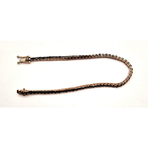 1021 - A 9K ROSE GOLD TENNIS BRACELET WITH 67 BLACK DIAMONDS TOTALLING 4ct  8.8gms  19cms .