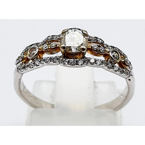 1177 - A 9K WHITE GOLD DIAMOND RING WITH .20ct CENTRE STONE  2.1gms  size M