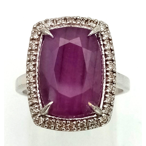 1184 - 14k White Gold Diamond and Ruby Ring. 0.32ct Diamond, 8.93cts Ruby. Total weight 5.55grams. Size N