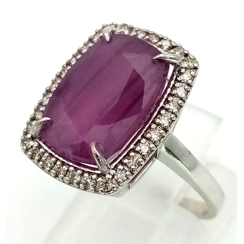 1184 - 14k White Gold Diamond and Ruby Ring. 0.32ct Diamond, 8.93cts Ruby. Total weight 5.55grams. Size N