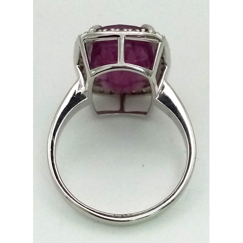 1184 - 14k White Gold Diamond and Ruby Ring. 0.32ct Diamond, 8.93cts Ruby. Total weight 5.55grams. Size N