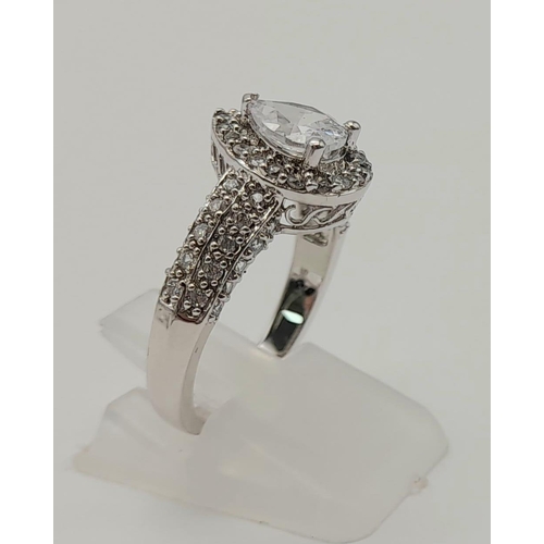 1178 - A 9K WHITE GOLD RING WITH TEAR DROP ZIRCONIA STONE AND SHOULDERS,   4.4gms   size O