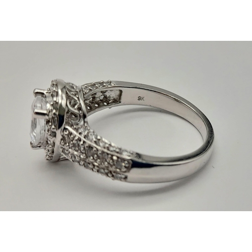 1178 - A 9K WHITE GOLD RING WITH TEAR DROP ZIRCONIA STONE AND SHOULDERS,   4.4gms   size O