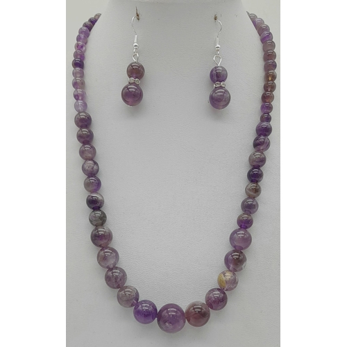 1482 - An Amethyst Graduated Bead Necklace With Matching Ball-Drop Earrings. Largest bead - 14mm. Earring d... 