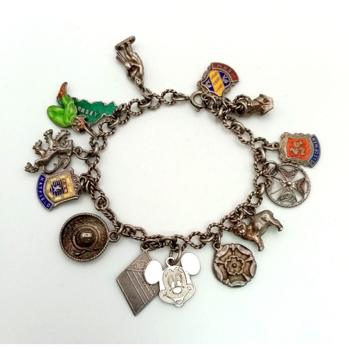 1481 - Vintage Silver Charm Bracelet. 28.4grams. 32cm length.