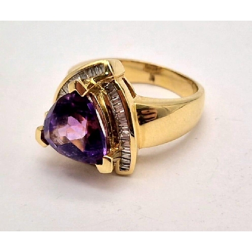 1192 - A 14K GOLD RING WITH LARGE TRIANGULAR AMETHYST CENTRE STONE SURROUNDED BY DIAMONDS.  11.9gms  size P