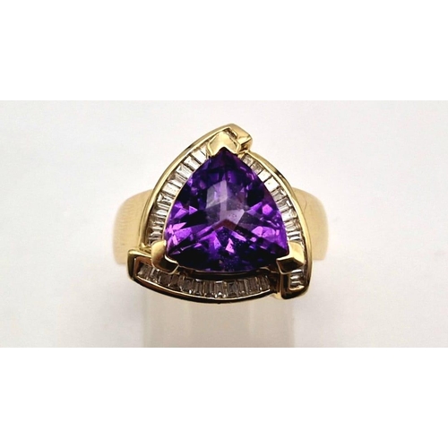 1192 - A 14K GOLD RING WITH LARGE TRIANGULAR AMETHYST CENTRE STONE SURROUNDED BY DIAMONDS.  11.9gms  size P